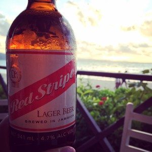 Sundance Vacations Fly Away A Travelers Review Jamaica Enjoying a Red Stripe Beer on the Beach