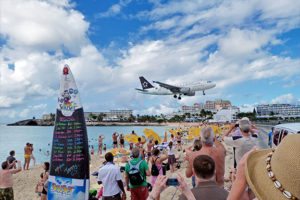 Watch as airplanes descend down right above your head while on the beach at St. Maarten!