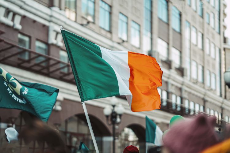 Irish flag flying during St. Patrick's Day parade